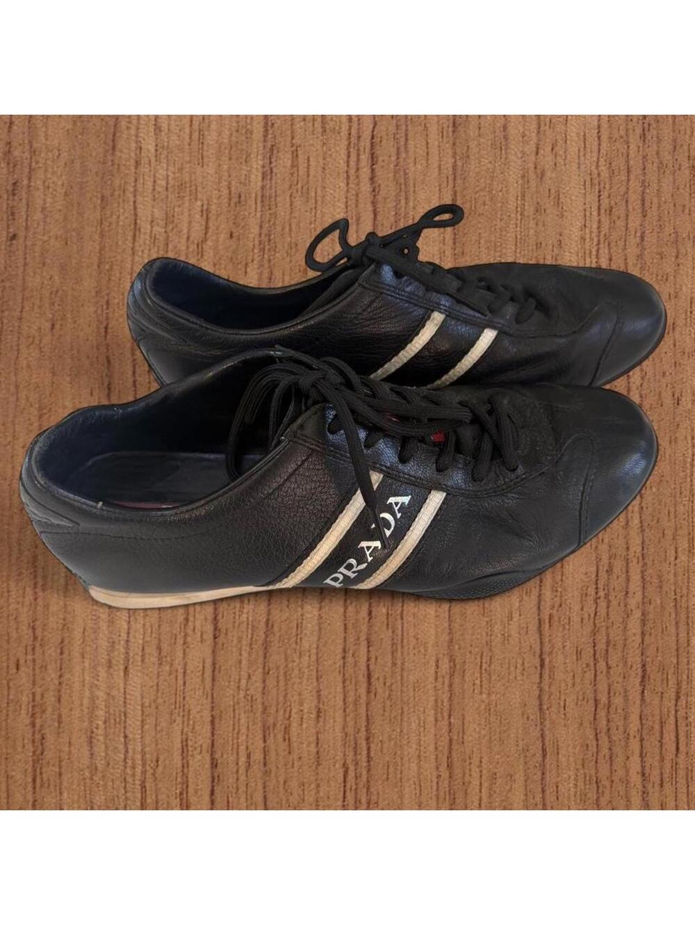 vintage leather Prada sneakers with white stripes and 'PRADA' text everywhere
